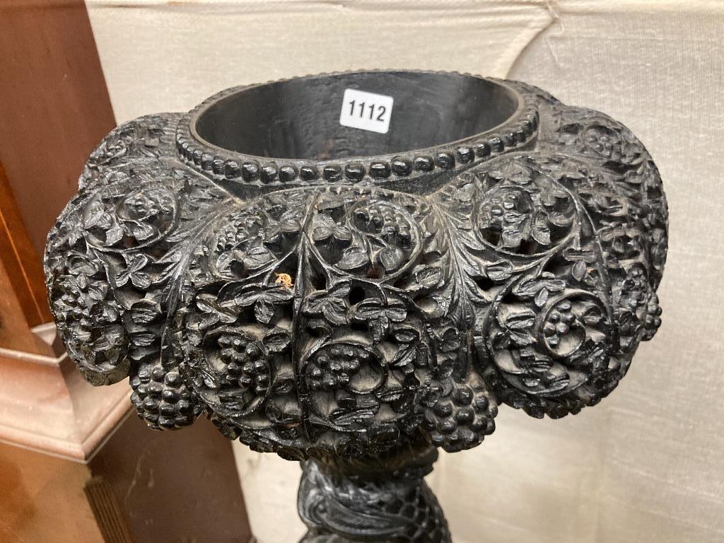 A late 19th century Burmese carved hardwood torchere, height 88cm